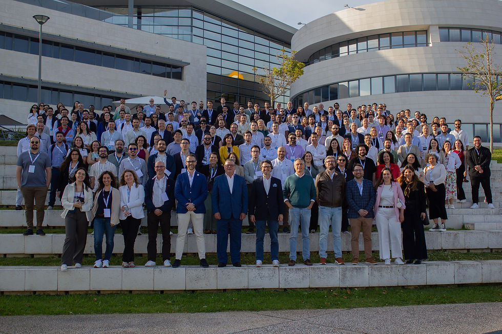 Unipartner team group photo from company event with rows of employees smiling and lining up on various stair steps