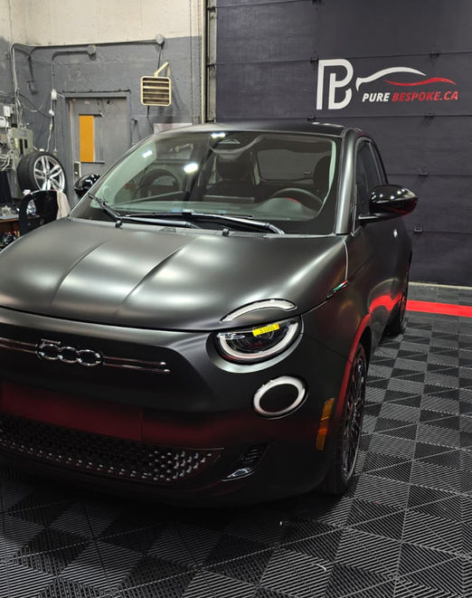 Fiat 500 wrapped in Satin Black vinyl with paint correction, clay bar treatment, and ceramic coating for satin wraps in Montreal.