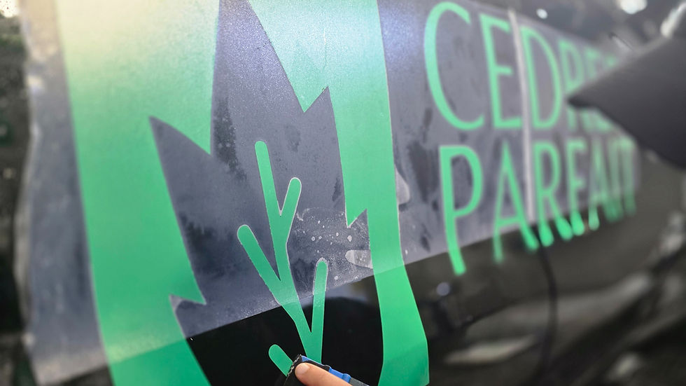Business logo vinyl decal installation on service vehicle in Montreal - Pure Bespoke branding solution
