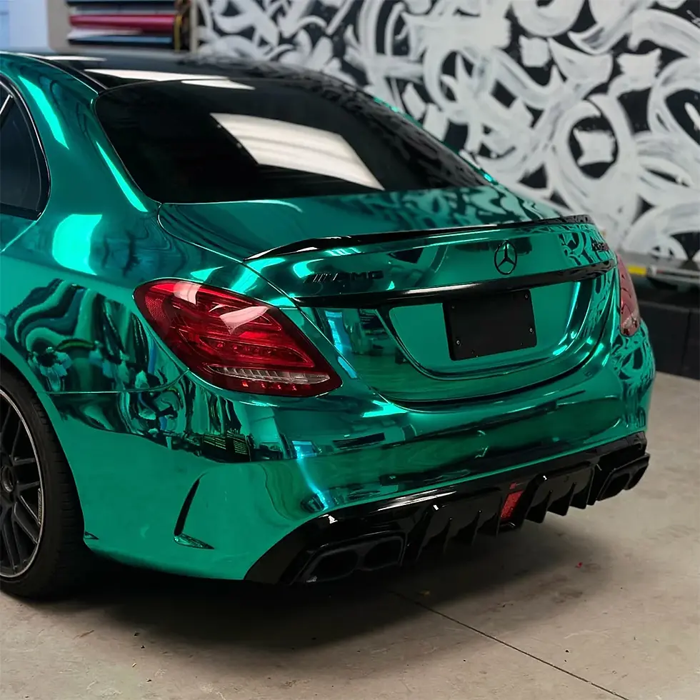 Thumbnail: Mirror Chrome Turquoise Color PPF by Bespoke Wraps applied to a Mercedes, rear view showing the high-gloss mirror chrome fini