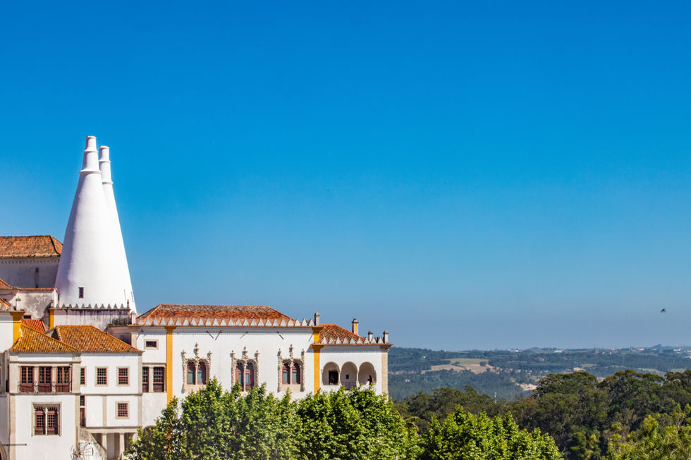 White building with unique architecture, Lisbon, Portugal, sunny day and clear blue sky. Jeff Bana Photography