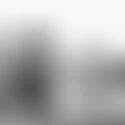 Cityscape with modern buildings reflecting in the water, skyline and cloudy sky.