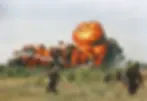 A fiery explosion following a U.S. napalm strike during the Vietnam War (1966).