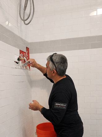 Professional shower wall tile repair.