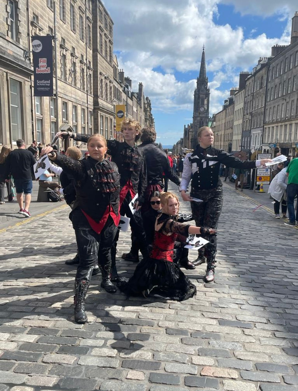 Meredith Fraley busking in the streets of Edinburgh, Scotland, at the FRINGE Festival.