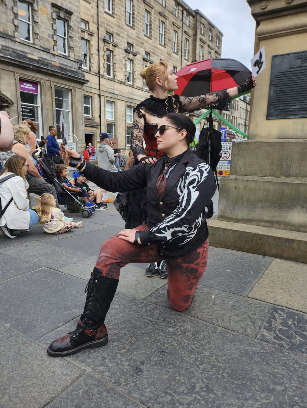 Meredith Fraley busking in the streets of Edinburgh, Scotland, at the FRINGE Festival.