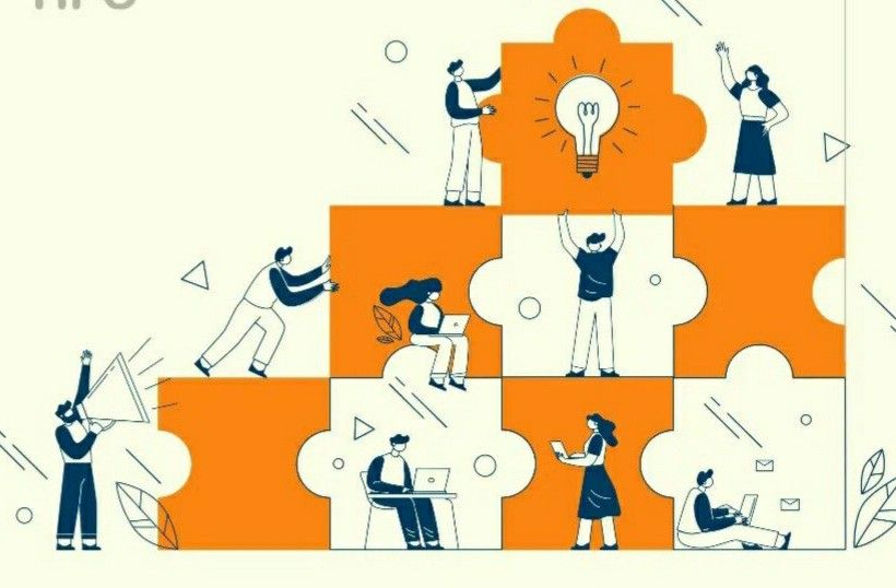 Equipe construindo um quebra-cabeça enquanto trabalham. Com a CNV para líderes, o líder guia a equipe neste trabalho.