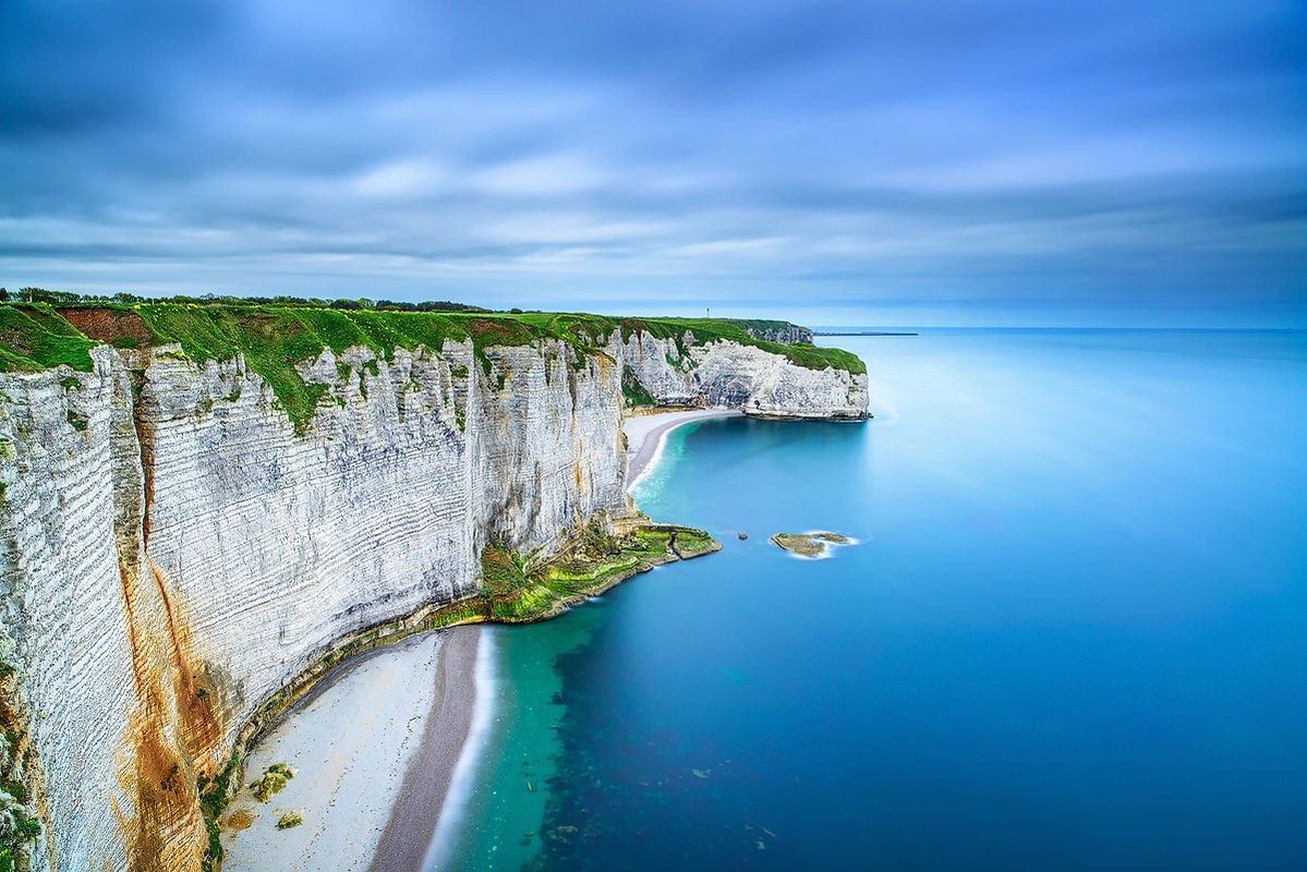 Etretat, rocky cliff and beach towards Le Havre. Long exposure photography. Aerial view. Normandy, France.