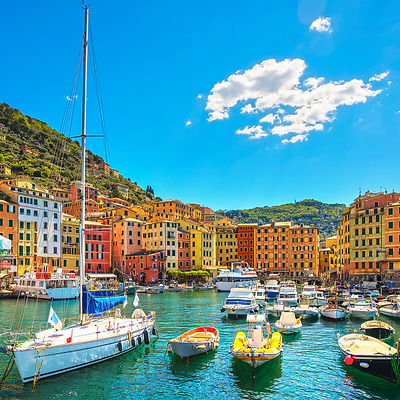 Camogli marina harbor, boats and typical colorful houses. Travel destination Ligury, Italy, Europe.