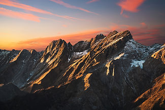 Apuane alpi or Apuan alps snowy mountains and marble quarry at sunset in winter. Carrara, Tuscany, Italy.