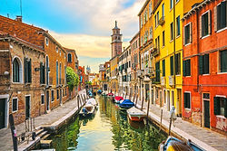 Venice cityscape, rio San Barnaba and Fondamenta del Squero water canal, church on background, building and boats. Italy, Europe