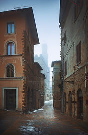 Volterra old town during a snowfall in winter. Pisa province, Tuscany, Italy, Europe.