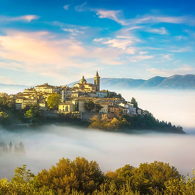 Trevi picturesque village in a foggy morning. Perugia, Umbria, Italy, Europe.