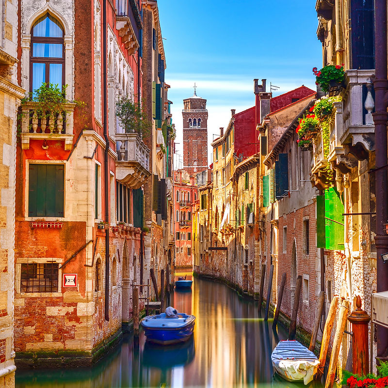 Venice cityscape, narrow water canal, bell tower on background and traditional buildings. Italy, Europe.