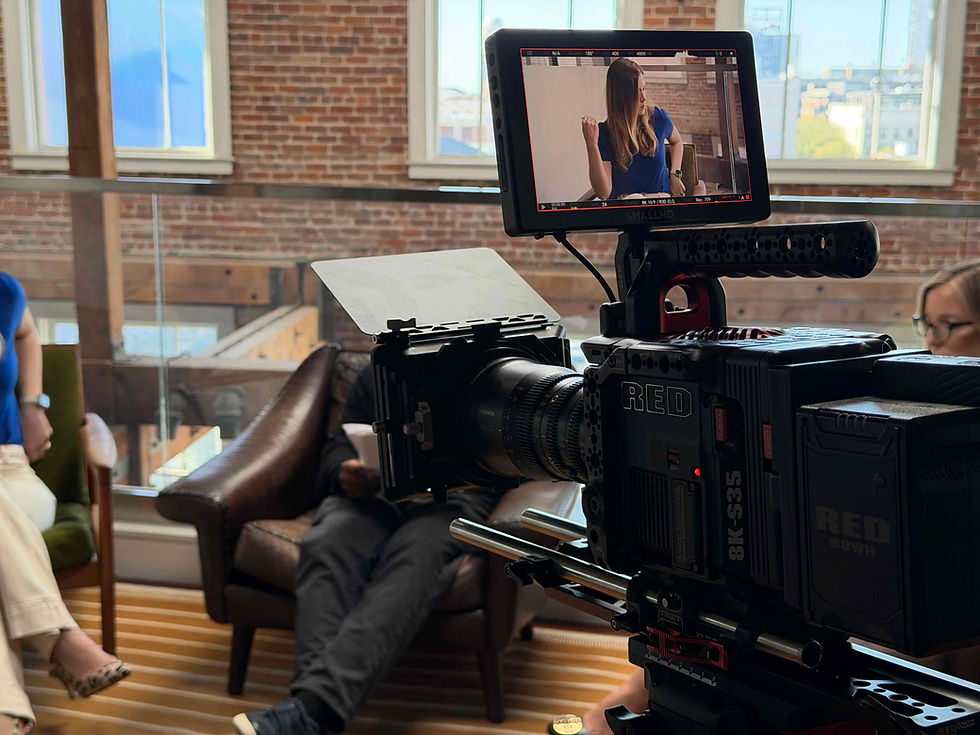 Close-up view of a director reviewing footage on a monitor during a TV commercial shoot