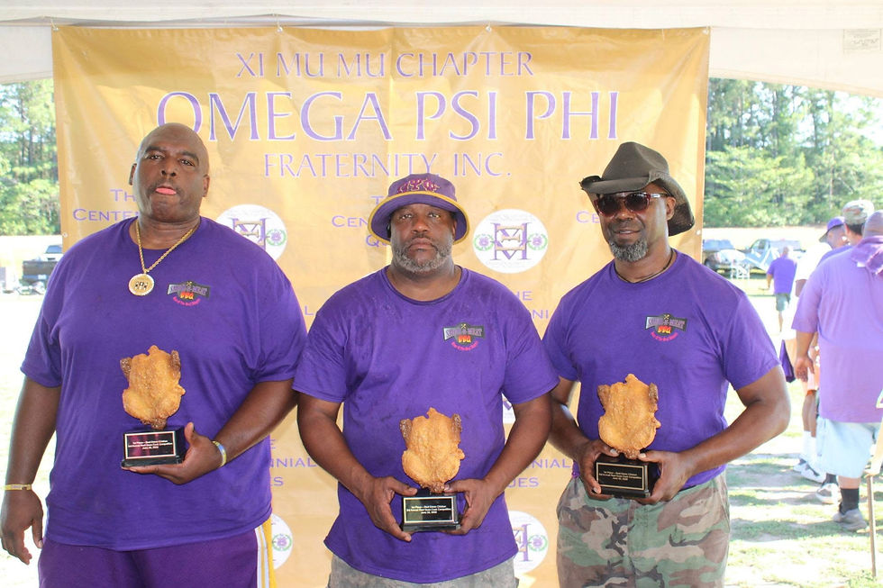 Hugh James, left, with two other participants at a previous grilling event.