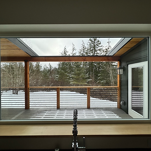 Open custom deck designed to provide natural light to kitchen window and interior living space