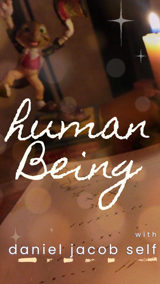 The logo for 'human being' consisting of the words 'human being' written in cursive on a background depicting a journal, candle, and a Jimminy Cricket figurine.