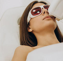 woman receiving laser treatment on her lip
