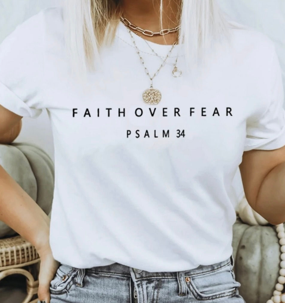 Christian graphic tee with “Faith Over Fear” text