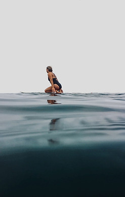 woman surfing on sea_edited.jpg