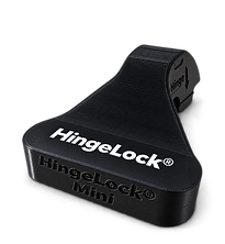 Black HingeLock® Mini hinge-mounted doorstop with the HingeLock® logo on top.