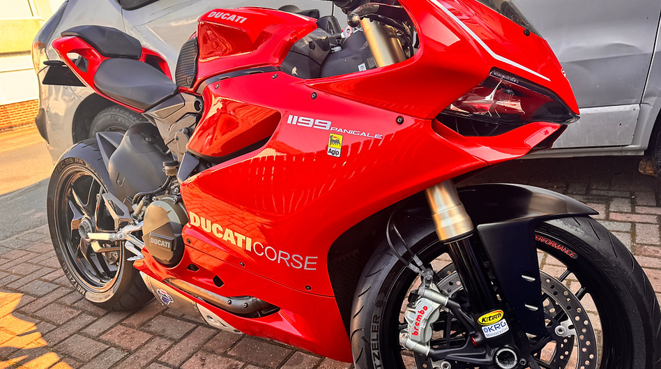 gleaming red ducati racing motorcycle detailed by demons detailing