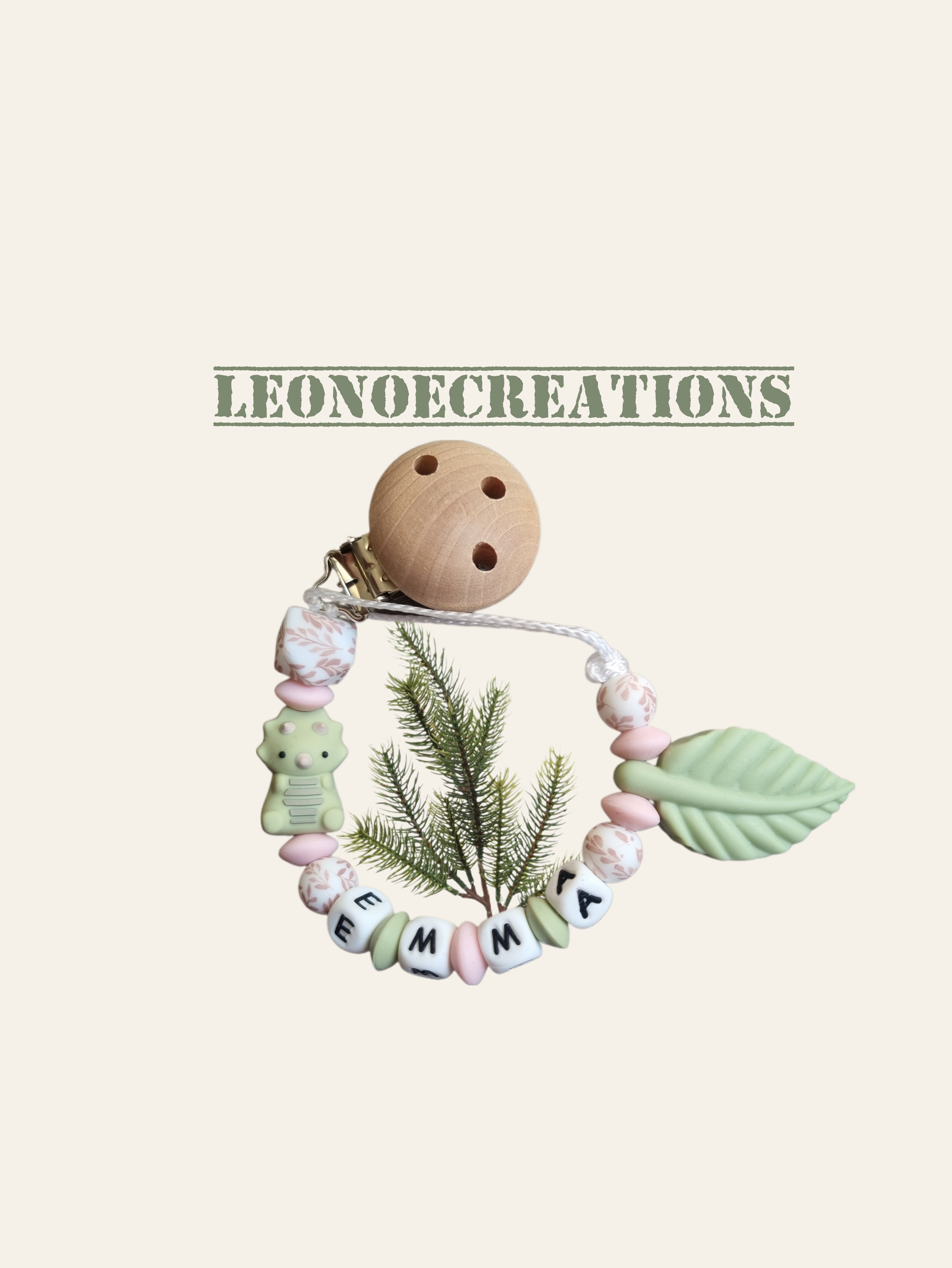 Attache tétine personnalisée silicone dinosaure rose , alliant sécurité, praticité et charme naturel pour accompagner bébé