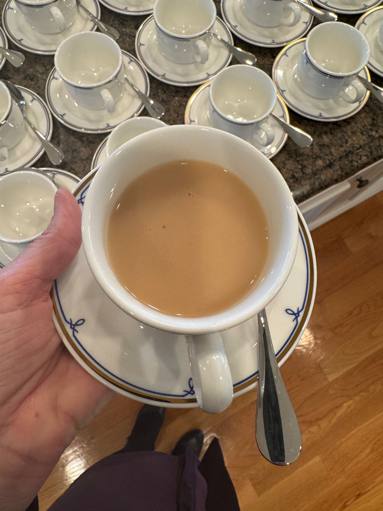 Cup and saucer with tea.