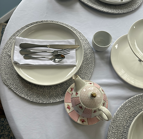 Pink and white place setting for a kids tea party