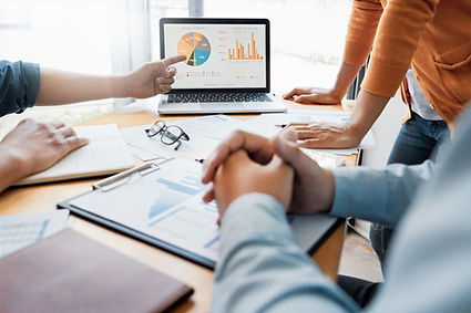 People looking around business statistics.