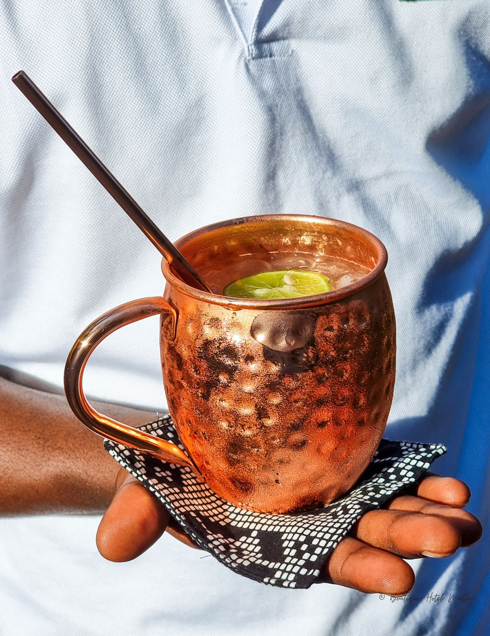 Moscow Mule cocktail at Zatiny Restaurant, Boutique Hotel Matlai Zanzibar, refreshing ginger and lime drink.