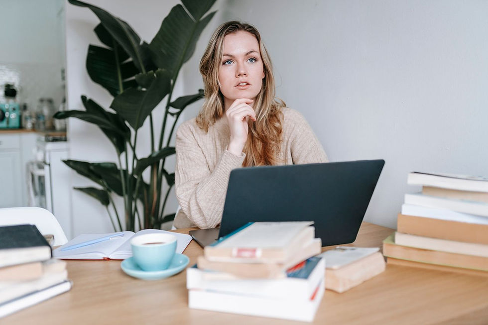 focused-businesswoman-thinking-on-project-at-laptop-at-home