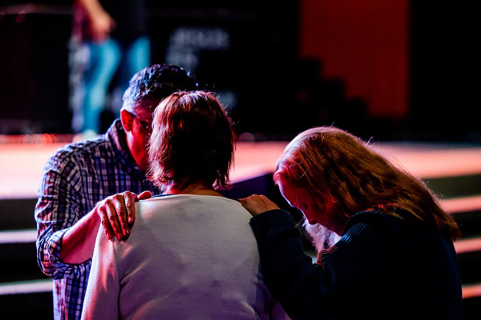 group-of-people-praying-in-church-setting