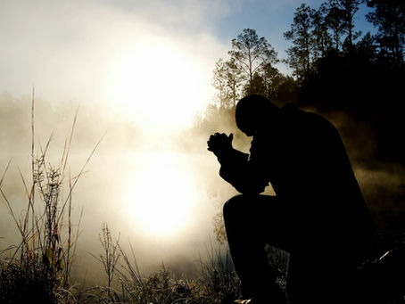 silhouette-of-kneeling-man