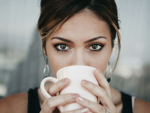 woman-drinking-from-white-coffee-cup