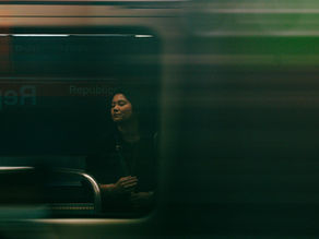 woman-standing-on-subway-platform