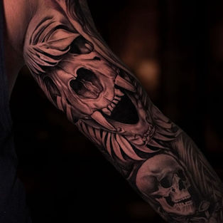 Skull and bone realism tattoo