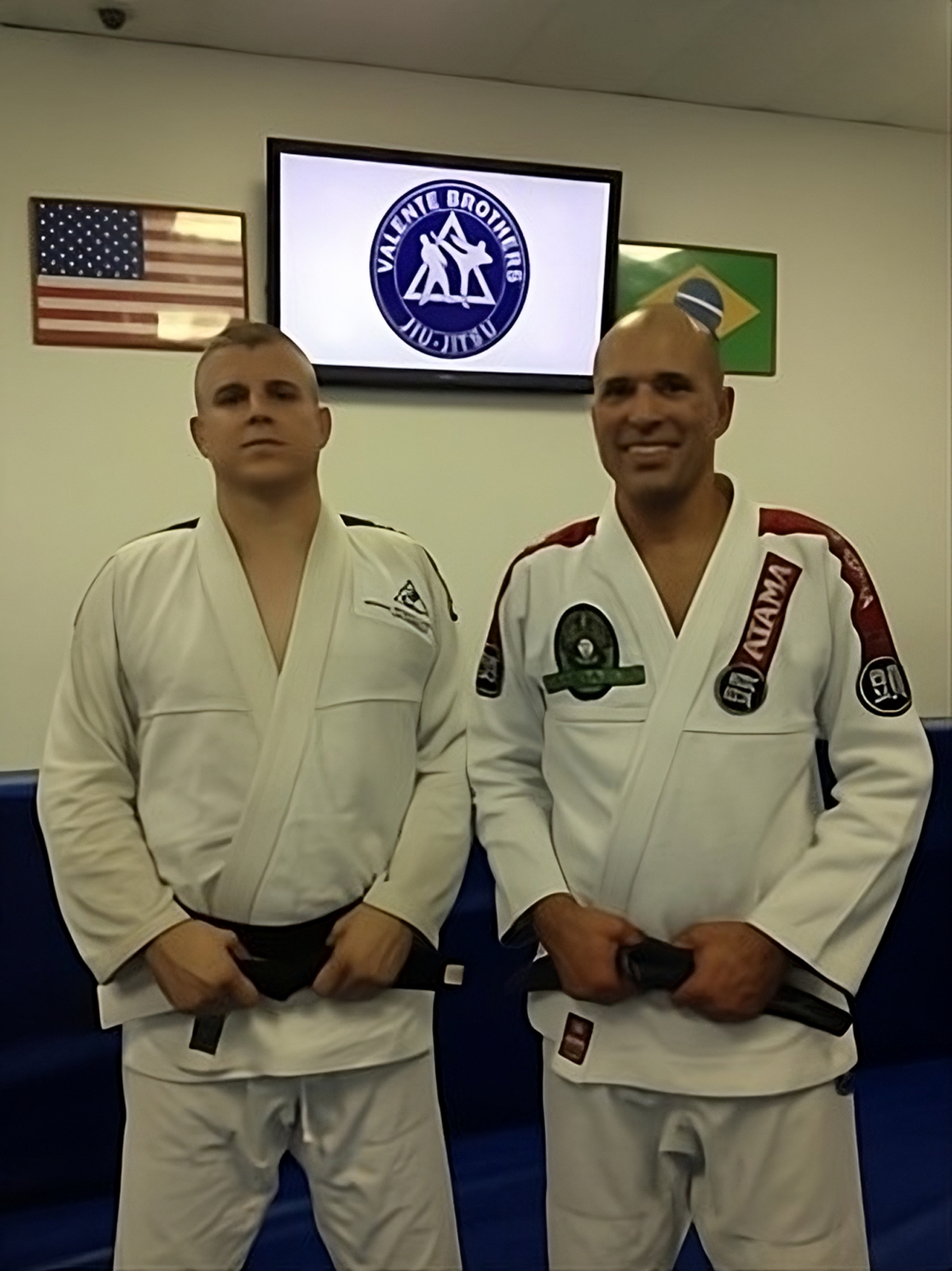 Royce posing with a new blackbelt student