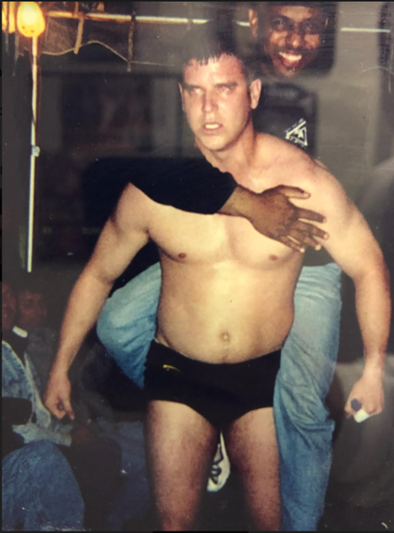  A friend holding back a fighter 