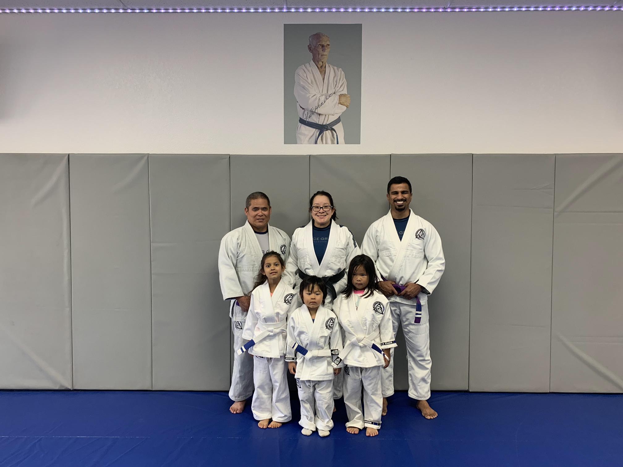 Intructors and young children posing for camera