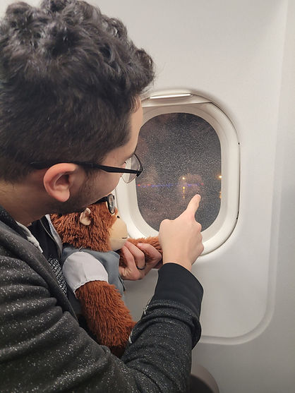 Amr Nosir The Future Party Founder and Monki looking out an airplane window