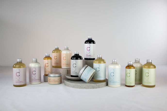 Lineup of OCS haircare products from the care range, designed with natural and organic ingredients to protect and nourish hair.