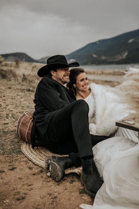 Bride and groom embracing in the cold wind off Kalamalka Lake in Vernon BC, Cardinal Vow Media photographer