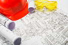 desk-with-hardhat-blueprints.jpg