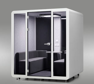 White QuadPod Pro 4 to 6 person modular privacy office booth with open glass doors showing interior benches.