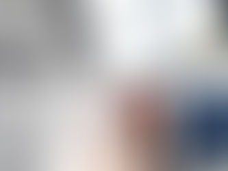 A fashion designer reviewing a garment sample on a mannequin, checking fit, stitching, and fabric details in a studio, representing the garment sample approval process before bulk production.