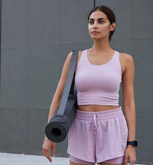 horizontal-shot-motivated-slim-woman-dressed-sportswear-prepares-hard-training-poses-with-