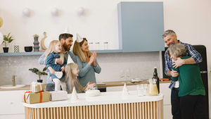 Toronto family gathered for a home celebration, representing special event cleaning services for house parties and family gatherings.