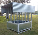 Empty Quast Metal roofed round bale feeder